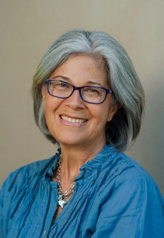 Isabel Montanez portrait of woman with short, gray hair and glasses
