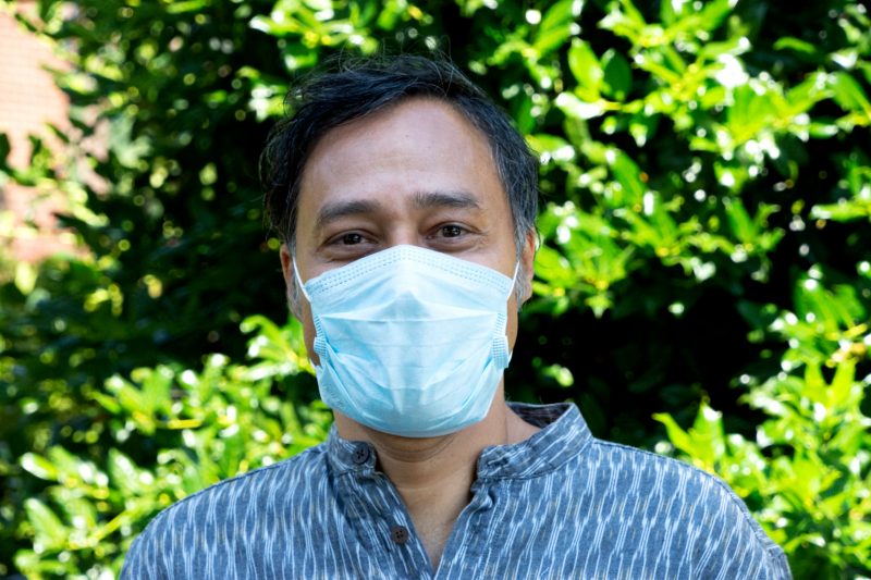 Sudipta Sarangi, photographed in his yard earlier this year. Meeting CDC and state health guidelines, Sarangi is wearing a mask to protect others during the COV ID-19 pandemic.